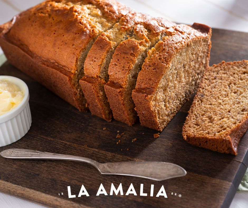 homemade banana bread sliced on a table served with coffee