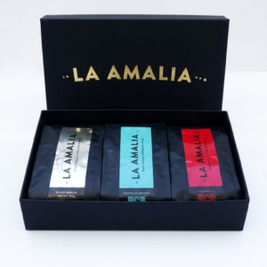 Elegant gold foil stamped coffee gift box with medium, dark, and espresso roast whole bean Arabica coffee